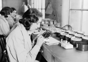 An old black and white photo of some of the "Radium Girls" painting watch faces using the hazardous element.